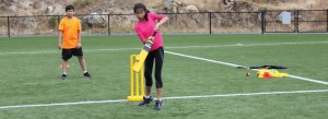 girl playing cricket