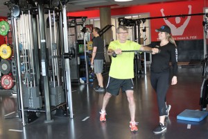 Man cable exercise with S&C coach