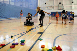 Girl using a power chair during summer camps