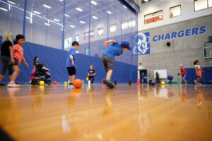 Wide angle photo of children playing in the gymnasium